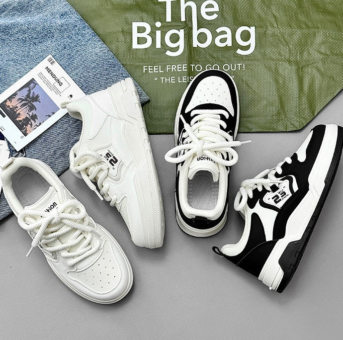 حذاء رياضي باللونين الأبيض والأسود 2024 – انطلق إلى الأناقة العصرية بثقة