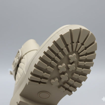 Women’s quilted ankle boots with strap and lug sole — Product image: