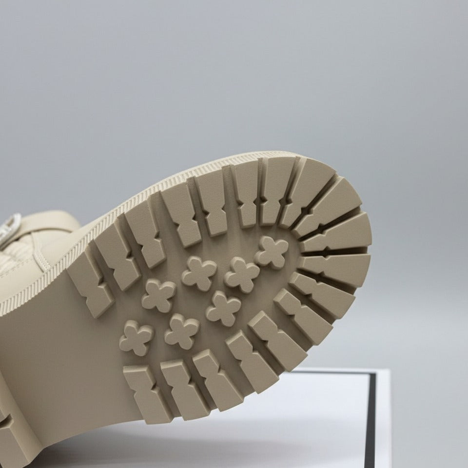 Women’s quilted ankle boots with strap and lug sole — Product image: