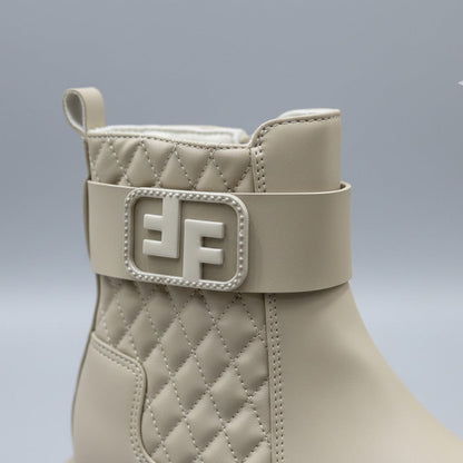Women’s quilted ankle boots with strap and lug sole — Product image: